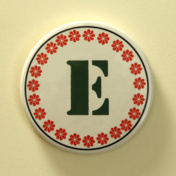 Monogram E coaster