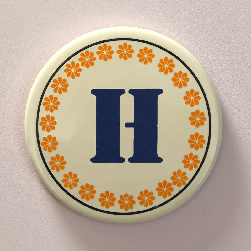 Monogram H coaster